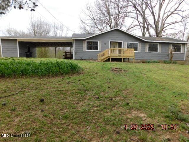165 Christian College Rd, Senatobia, MS 38668 - back of property with a carport and a yard