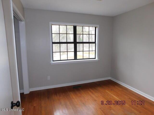 165 Christian College Rd, Senatobia, MS 38668 - unfurnished bedroom with wood finished floors and baseboards