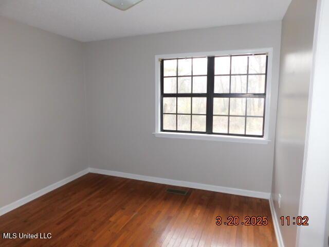 165 Christian College Rd, Senatobia, MS 38668 - spare room featuring wood-type flooring and baseboards