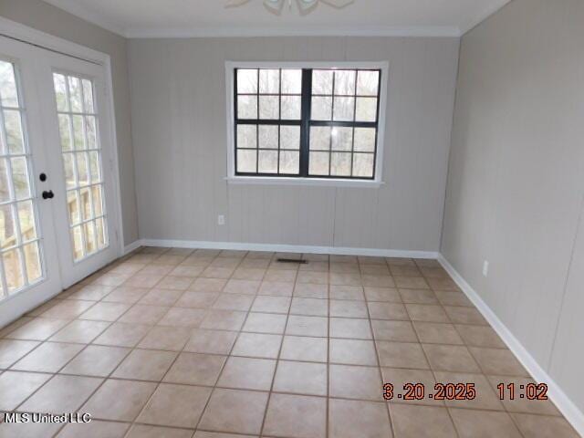 165 Christian College Rd, Senatobia, MS 38668 - unfurnished room with french doors, baseboards, ornamental molding, and light tile patterned floors
