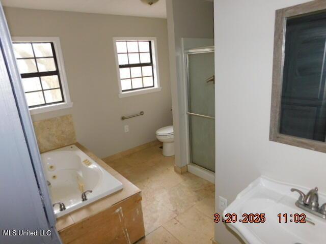 165 Christian College Rd, Senatobia, MS 38668 - full bathroom with toilet, a jetted tub, and a shower stall