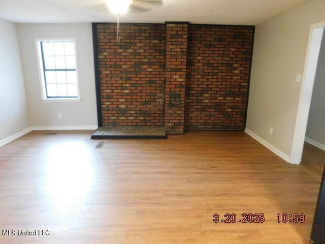 165 Christian College Rd, Senatobia, MS 38668 - unfurnished room with a ceiling fan, baseboards, and wood finished floors