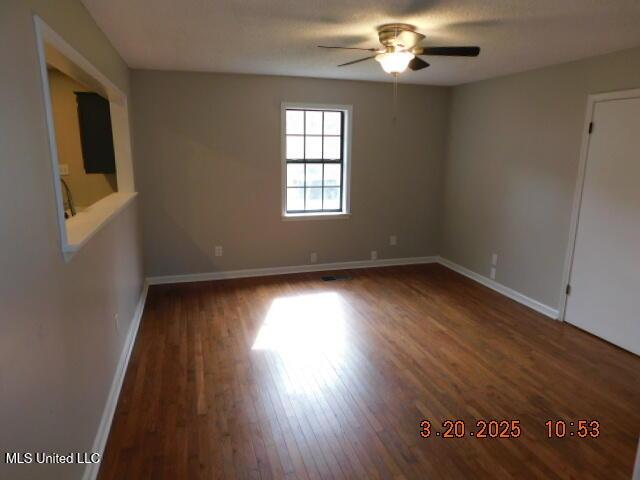 165 Christian College Rd, Senatobia, MS 38668 - empty room with ceiling fan, wood finished floors, and baseboards