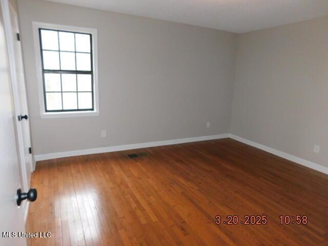 165 Christian College Rd, Senatobia, MS 38668 - spare room featuring hardwood / wood-style floors and baseboards