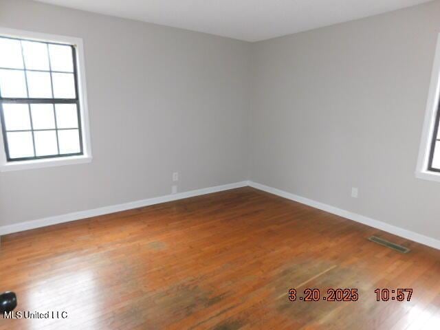 165 Christian College Rd, Senatobia, MS 38668 - unfurnished room with plenty of natural light, wood finished floors, and baseboards