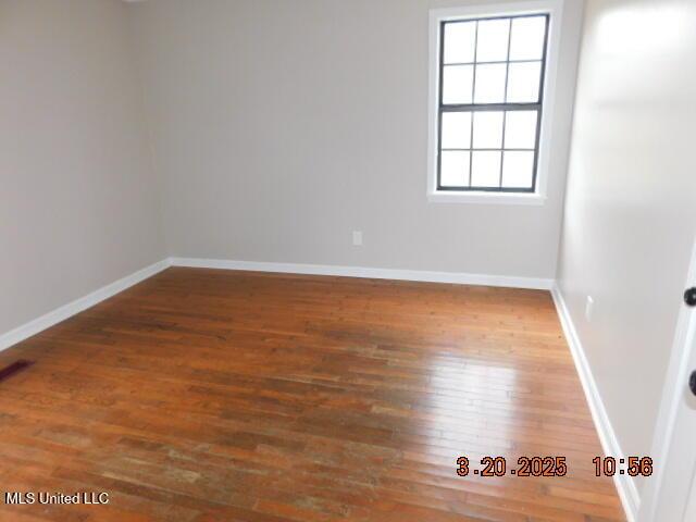 165 Christian College Rd, Senatobia, MS 38668 - spare room with wood finished floors and baseboards