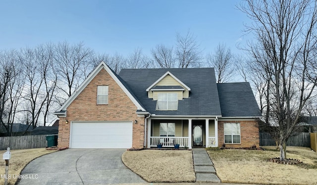 view of front of home featuring a garage and a porch