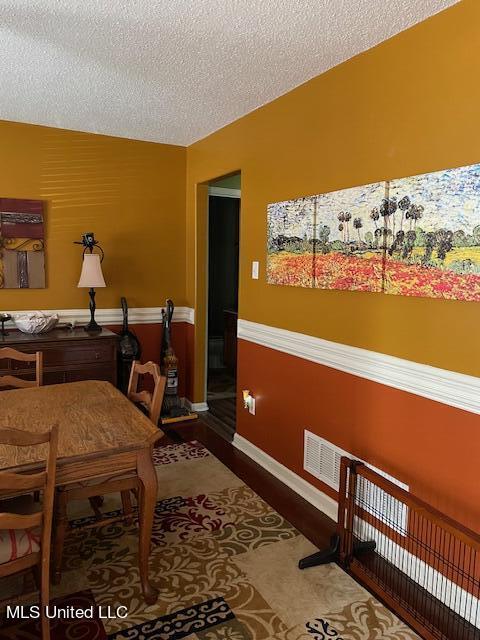 interior space featuring a textured ceiling