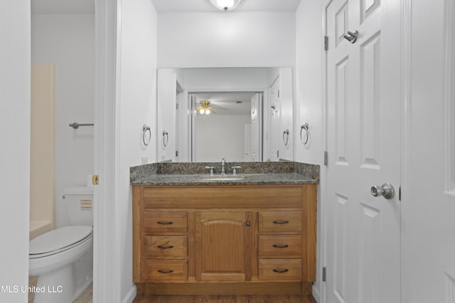 226 Boggs Cir, Long Beach, MS 39560 - full bathroom with vanity, toilet, a ceiling fan, and wood finished floors