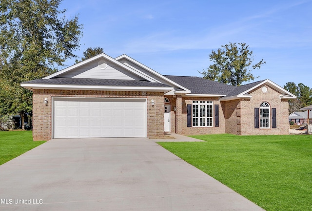 ranch-style home with a front lawn and a garage