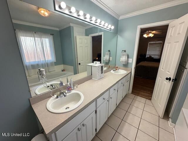 bathroom with vanity, tile patterned floors, ceiling fan, and ornamental molding