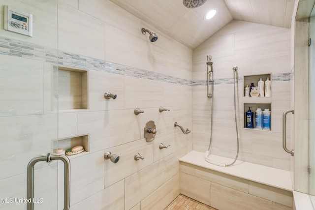 13129 Jordan Bluff Rd, Kiln, MS 39556 - bathroom featuring a stall shower, vaulted ceiling, and tile patterned flooring