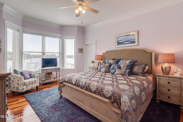 13129 Jordan Bluff Rd, Kiln, MS 39556 - bedroom with wood finished floors, ornamental molding, and a ceiling fan