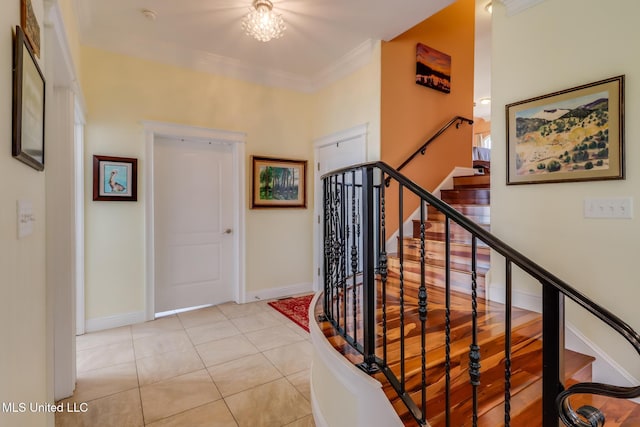 13129 Jordan Bluff Rd, Kiln, MS 39556 - stairway with crown molding, baseboards, and tile patterned floors