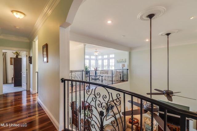 13129 Jordan Bluff Rd, Kiln, MS 39556 - hallway featuring wood finished floors, arched walkways, baseboards, crown molding, and recessed lighting