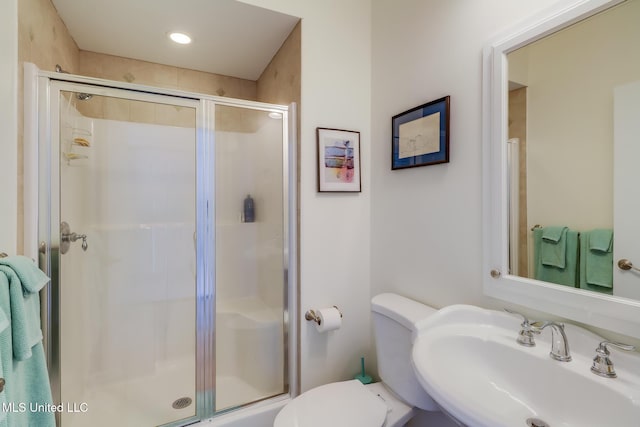 13129 Jordan Bluff Rd, Kiln, MS 39556 - bathroom featuring a sink, a shower stall, and toilet