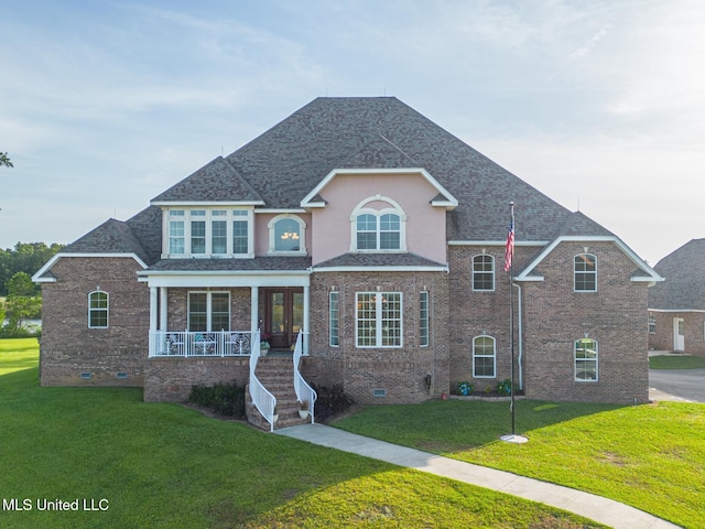 13129 Jordan Bluff Rd, Kiln, MS 39556 - traditional home featuring crawl space, covered porch, a front yard, and roof with shingles