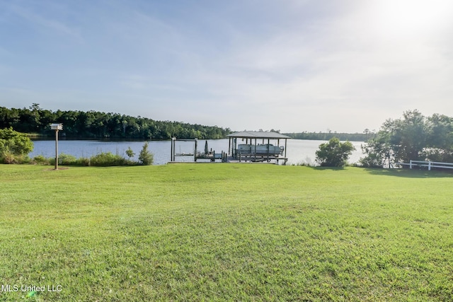 13129 Jordan Bluff Rd, Kiln, MS 39556 - dock area with boat lift, a water view, and a yard