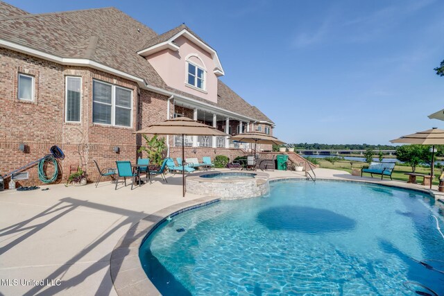 13129 Jordan Bluff Rd, Kiln, MS 39556 - view of swimming pool featuring a patio area and a pool with connected hot tub