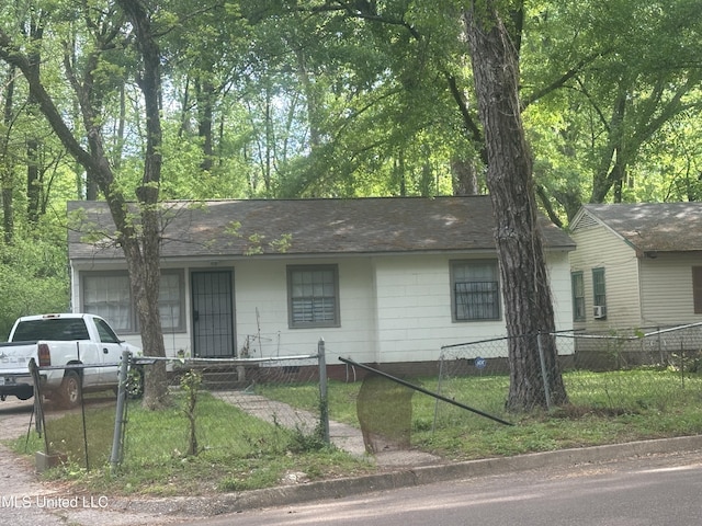 3805 Jayne Ave, Jackson, MS 39209 - ranch-style house with a fenced front yard, crawl space, and roof with shingles