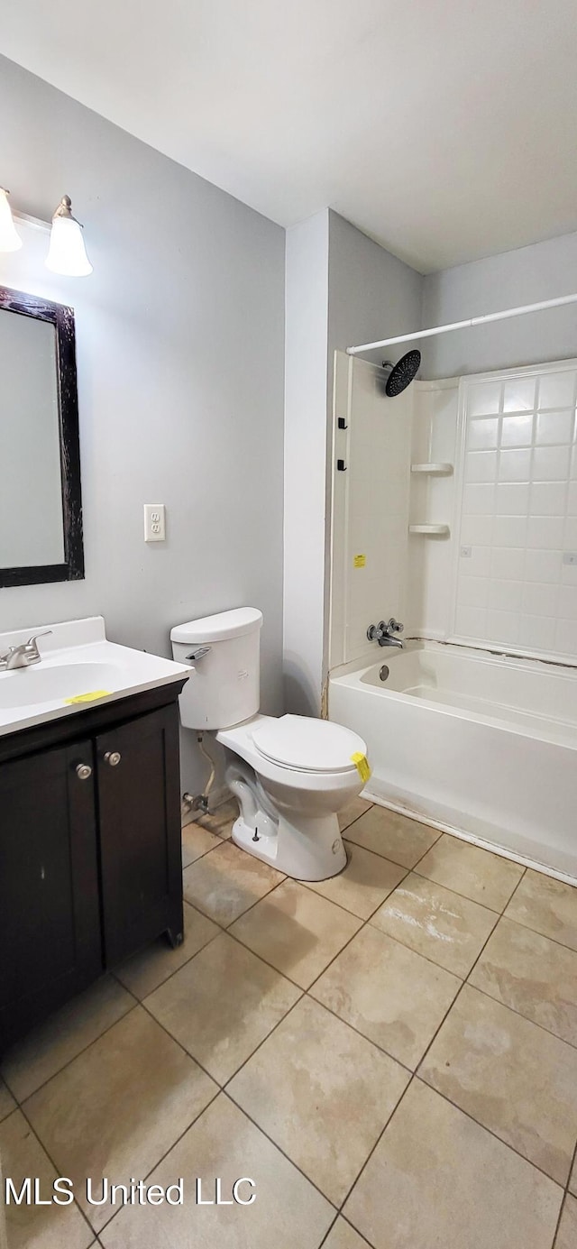 full bathroom with washtub / shower combination, tile patterned floors, vanity, and toilet