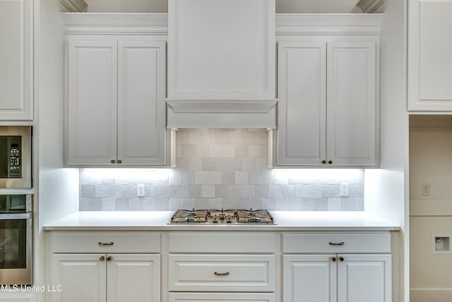 kitchen featuring white cabinetry and appliances with stainless steel finishes