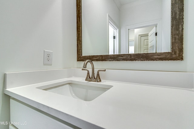 bathroom featuring vanity and crown molding