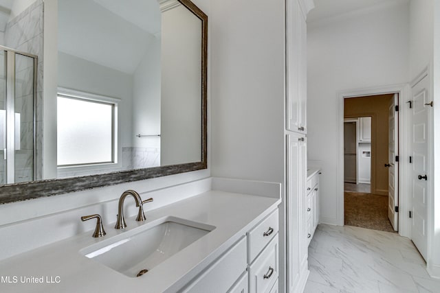 bathroom with vanity, walk in shower, and vaulted ceiling