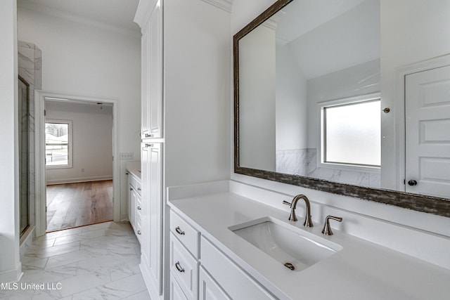 bathroom featuring crown molding, hardwood / wood-style floors, vaulted ceiling, a shower with door, and vanity