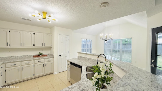 2595 Hunters Pointe Dr, Southaven, MS 38672 - kitchen featuring a chandelier, dishwasher, healthy amount of natural light, light tile patterned floors, and lofted ceiling