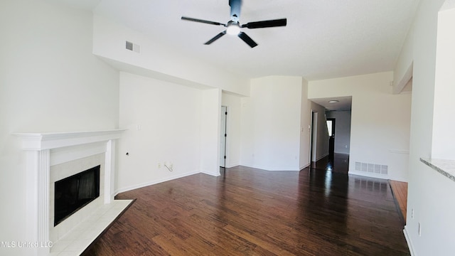 2595 Hunters Pointe Dr, Southaven, MS 38672 - unfurnished living room featuring ceiling fan, wood finished floors, and a fireplace