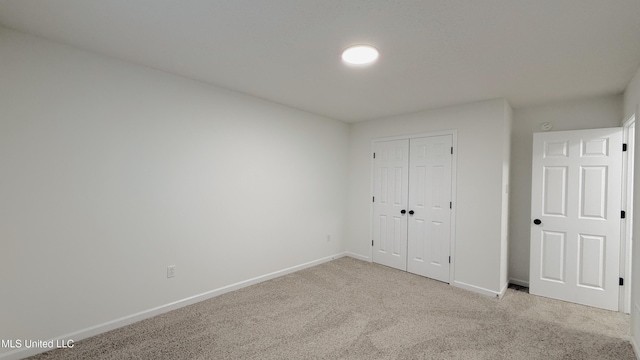2595 Hunters Pointe Dr, Southaven, MS 38672 - unfurnished bedroom with light carpet and a closet