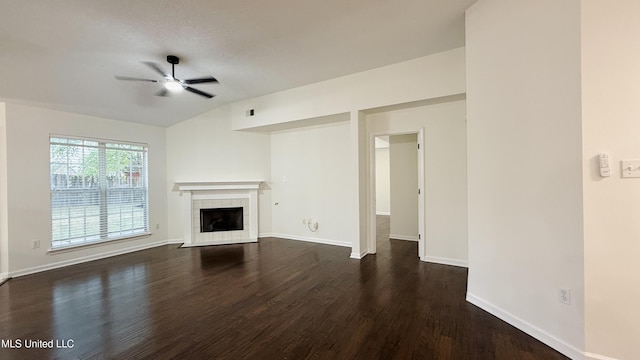2595 Hunters Pointe Dr, Southaven, MS 38672 - unfurnished living room featuring ceiling fan, dark wood-style flooring, a fireplace, and lofted ceiling