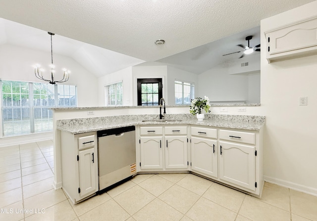 2595 Hunters Pointe Dr, Southaven, MS 38672 - kitchen with dishwashing machine, vaulted ceiling, light tile patterned floors, a chandelier, and a ceiling fan