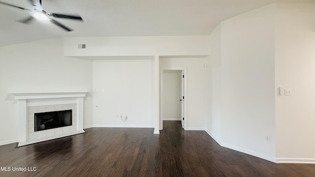 2595 Hunters Pointe Dr, Southaven, MS 38672 - unfurnished living room featuring a ceiling fan, dark wood-style flooring, and a tile fireplace