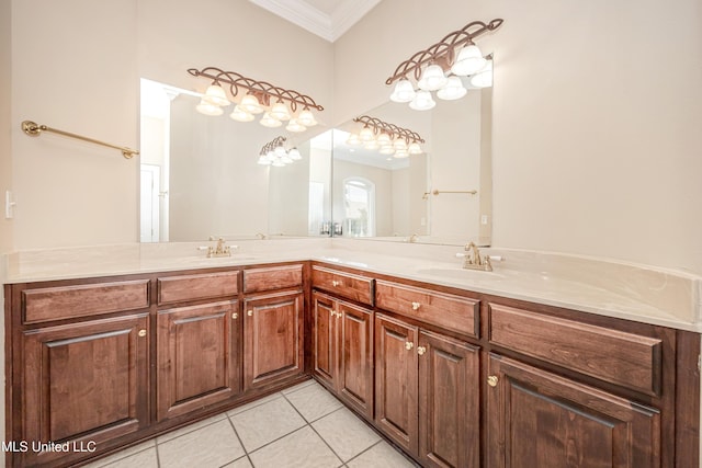 bathroom with ornamental molding, tile patterned flooring, and double vanity
