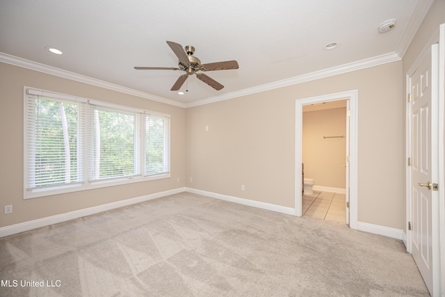 unfurnished bedroom with light carpet, ornamental molding, baseboards, recessed lighting, and ensuite bath