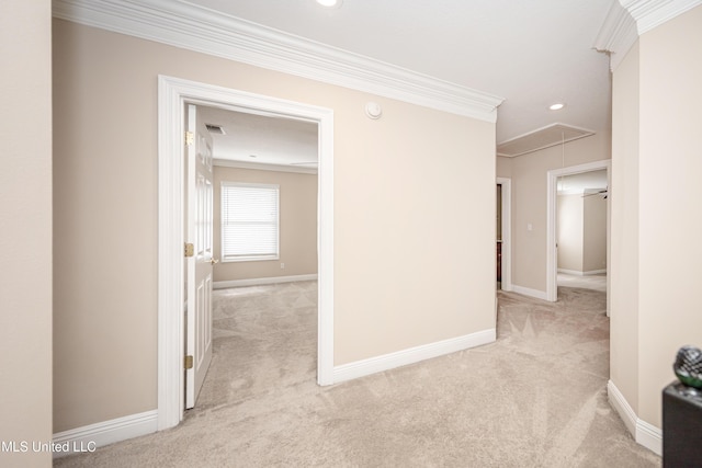 hallway featuring attic access, ornamental molding, light carpet, baseboards, and recessed lighting