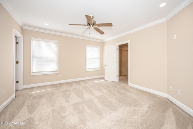 spare room with ornamental molding, light colored carpet, baseboards, recessed lighting, and ceiling fan