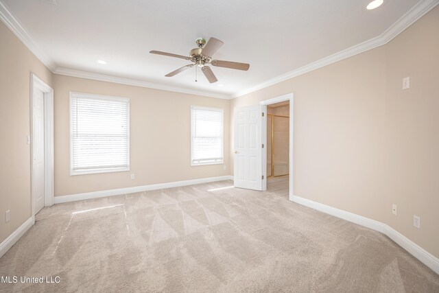 spare room with light colored carpet, crown molding, recessed lighting, a ceiling fan, and baseboards