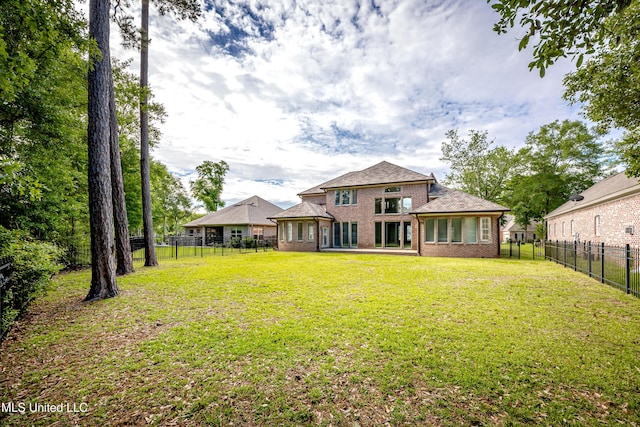 rear view of house with brick siding