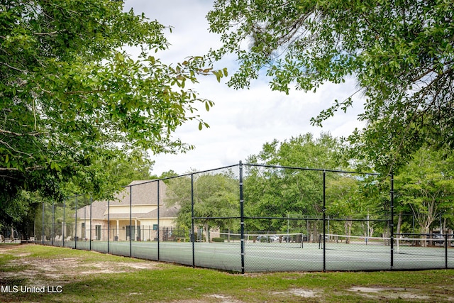 view of tennis court with fence