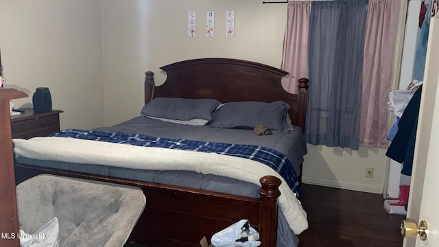 bedroom featuring dark hardwood / wood-style floors