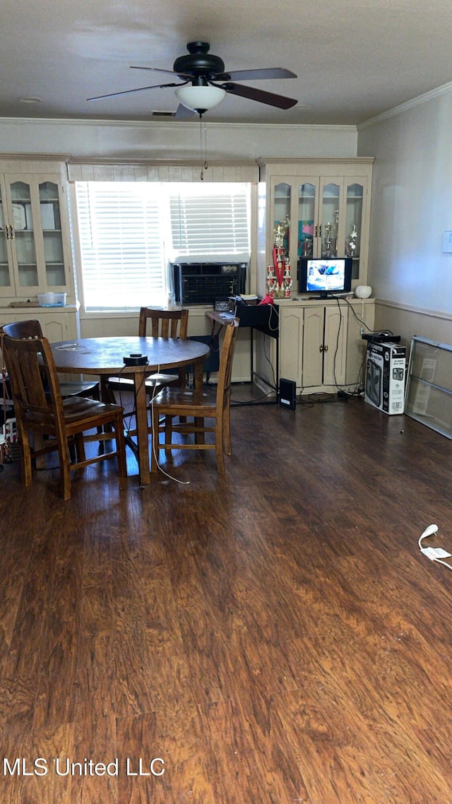 dining area with ornamental molding, dark hardwood / wood-style floors, cooling unit, and ceiling fan