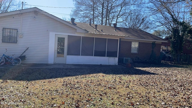 back of property featuring a sunroom