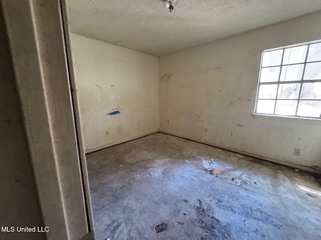 908 Wabash Ave, Vicksburg, MS 39183 - unfurnished room featuring a textured ceiling