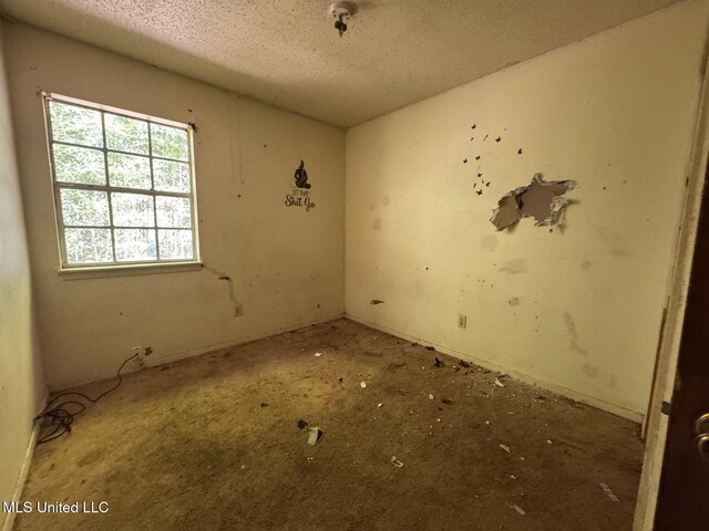 908 Wabash Ave, Vicksburg, MS 39183 - unfurnished room with a textured ceiling