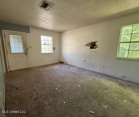908 Wabash Ave, Vicksburg, MS 39183 - spare room featuring visible vents and a textured ceiling