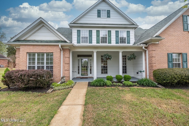 view of front of house featuring a porch and a front lawn