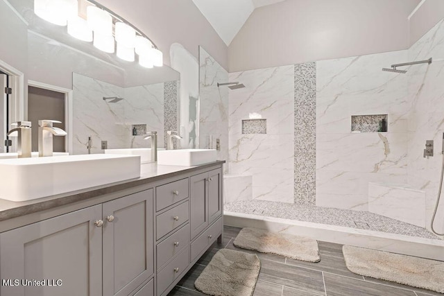 8992 Gavin Dr, Olive Branch, MS 38654 - bathroom with double vanity, a marble finish shower, and vaulted ceiling